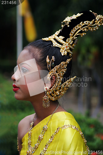 Image of Woman in bright traditional dress during a parade in Phuket, Tha