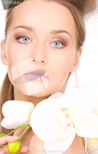 Image of beautiful woman with white flower