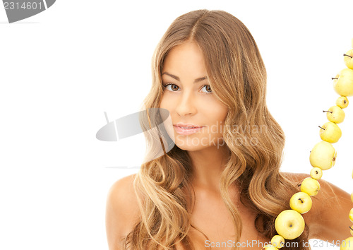 Image of lovely woman with green apples 