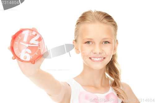 Image of girl holding alarm clock