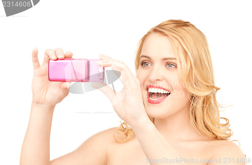 Image of happy woman using phone camera