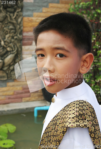 Image of Boy in traditional dress during a parade in Phuket, Thailand - E