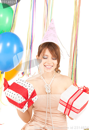 Image of party girl with balloons and gift box