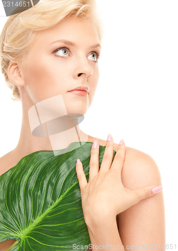 Image of woman with green leaf
