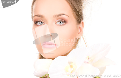 Image of beautiful woman with white flower