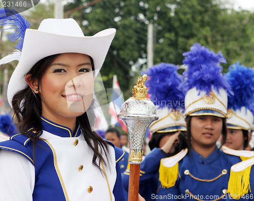 Image of  Thai students in a marching band participate in a parade, Phuke