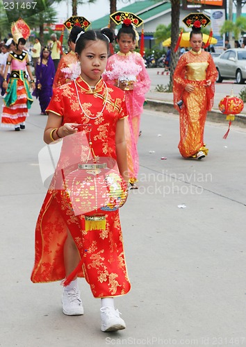 Image of Thai student holds a Chinese lantern during a parade, Phuket, Th