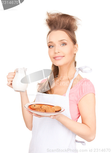 Image of housewife with milk and cookies