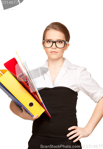 Image of young attractive businesswoman with folders 