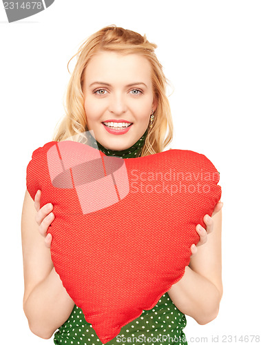 Image of woman with red heart-shaped pillow