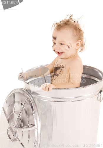 Image of baby in trash can