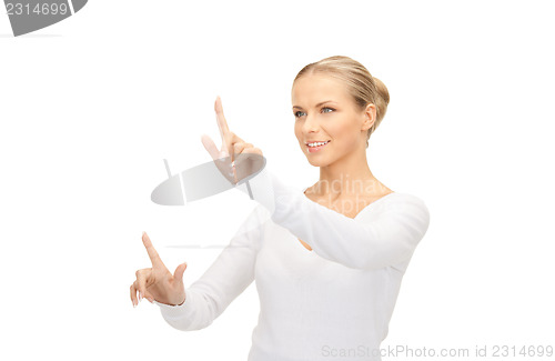 Image of businesswoman working with something imaginary