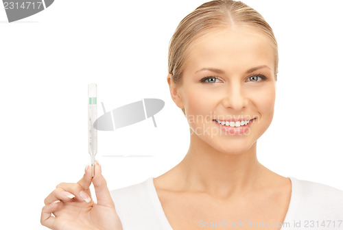 Image of attractive female doctor with thermometer