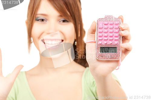 Image of lovely teenage girl with calculator