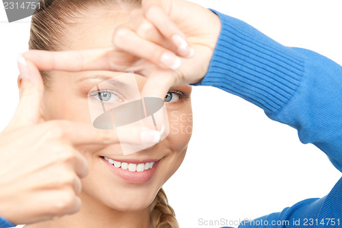 Image of lovely woman creating a frame with fingers