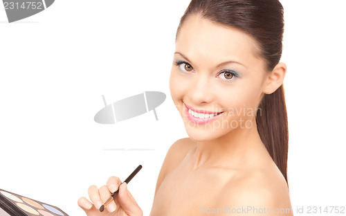 Image of lovely woman with palette and brush