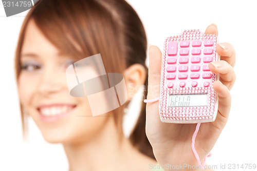 Image of lovely teenage girl with calculator