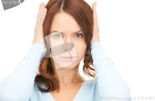 Image of woman with hands on ears
