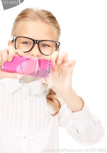 Image of happy girl taking picture with cell phone