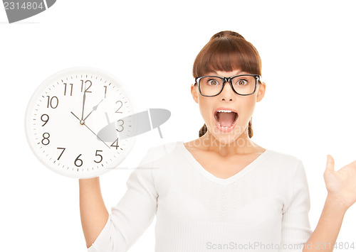 Image of woman holding big clock