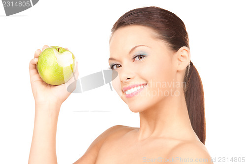 Image of young beautiful woman with green apple
