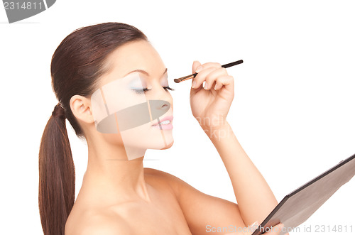 Image of lovely woman with palette and brush