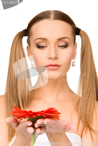Image of woman in towel with red flower