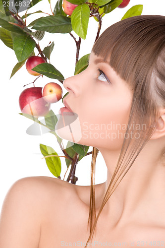 Image of lovely woman with apple twig