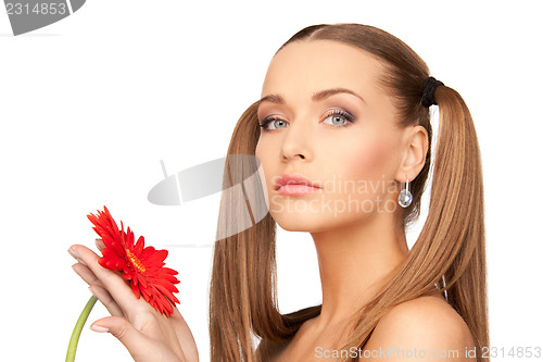 Image of woman in towel with red flower
