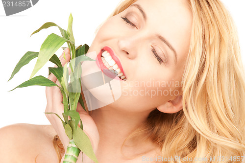 Image of woman with sprout over white