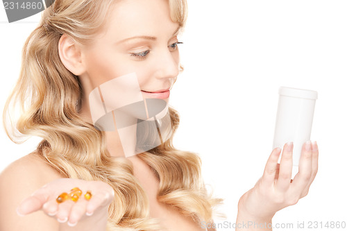 Image of young woman with pills