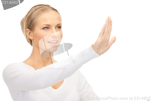 Image of businesswoman working with something imaginary