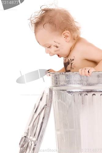 Image of baby in trash can