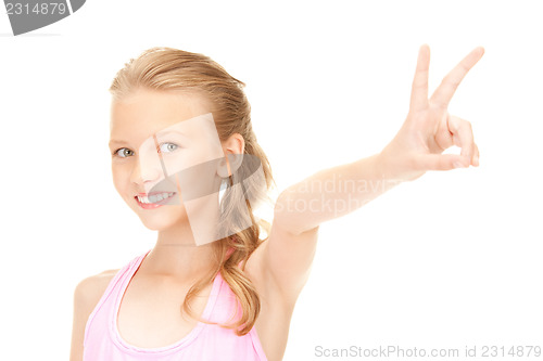 Image of lovely girl showing victory sign