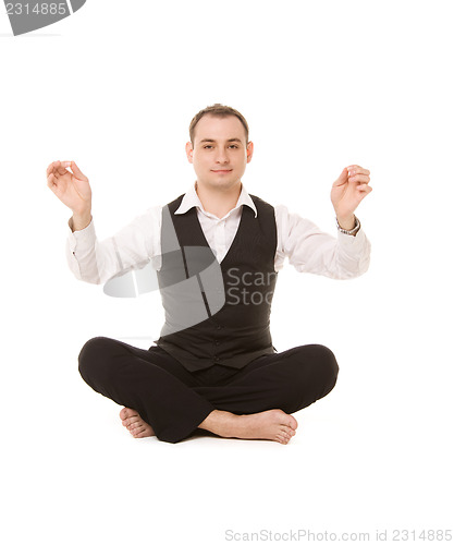 Image of businessman sitting in lotus pose