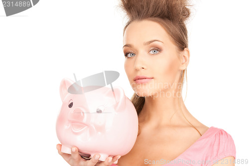 Image of lovely woman with piggy bank