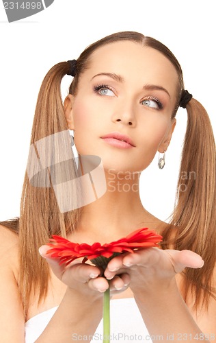 Image of woman in towel with red flower
