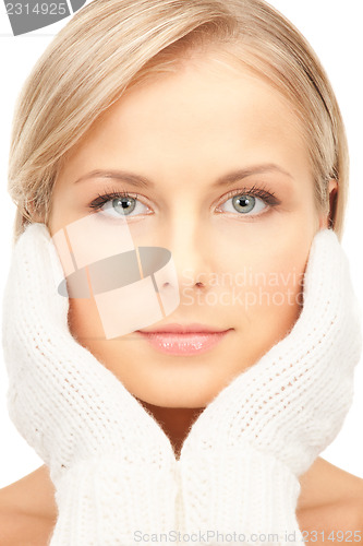 Image of beautiful woman in white mittens