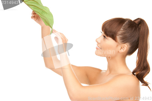 Image of woman with green leaf
