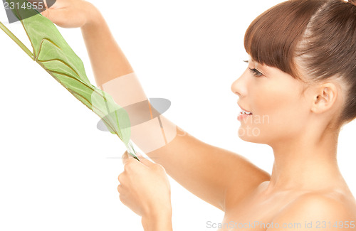 Image of woman with green leaf
