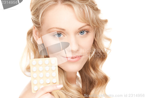 Image of young woman with pills