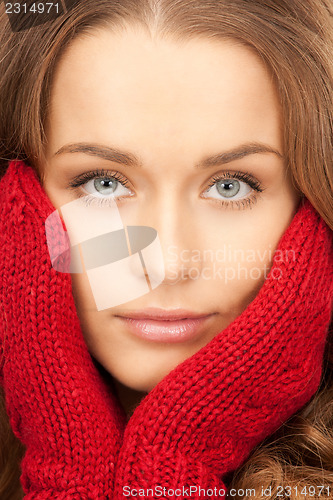 Image of beautiful woman in red mittens 