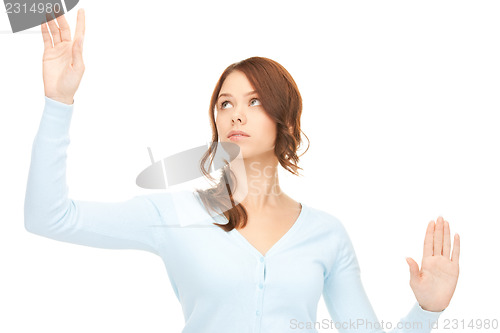 Image of businesswoman working with something imaginary