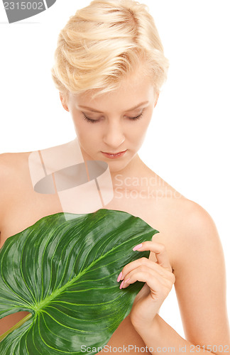 Image of woman with green leaf