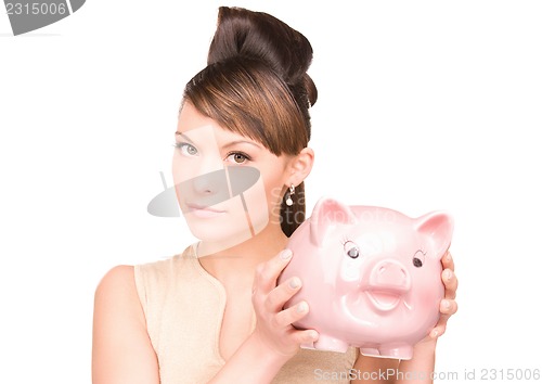 Image of lovely woman with piggy bank