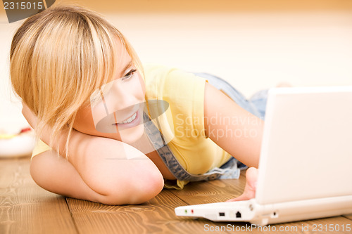 Image of teenage girl with laptop computer