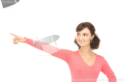 Image of attractive businesswoman pointing her finger