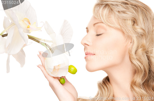 Image of beautiful woman with white flower