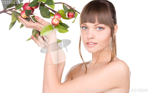 Image of lovely woman with apple twig