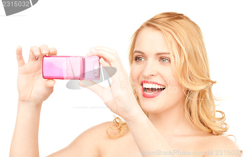 Image of happy woman using phone camera